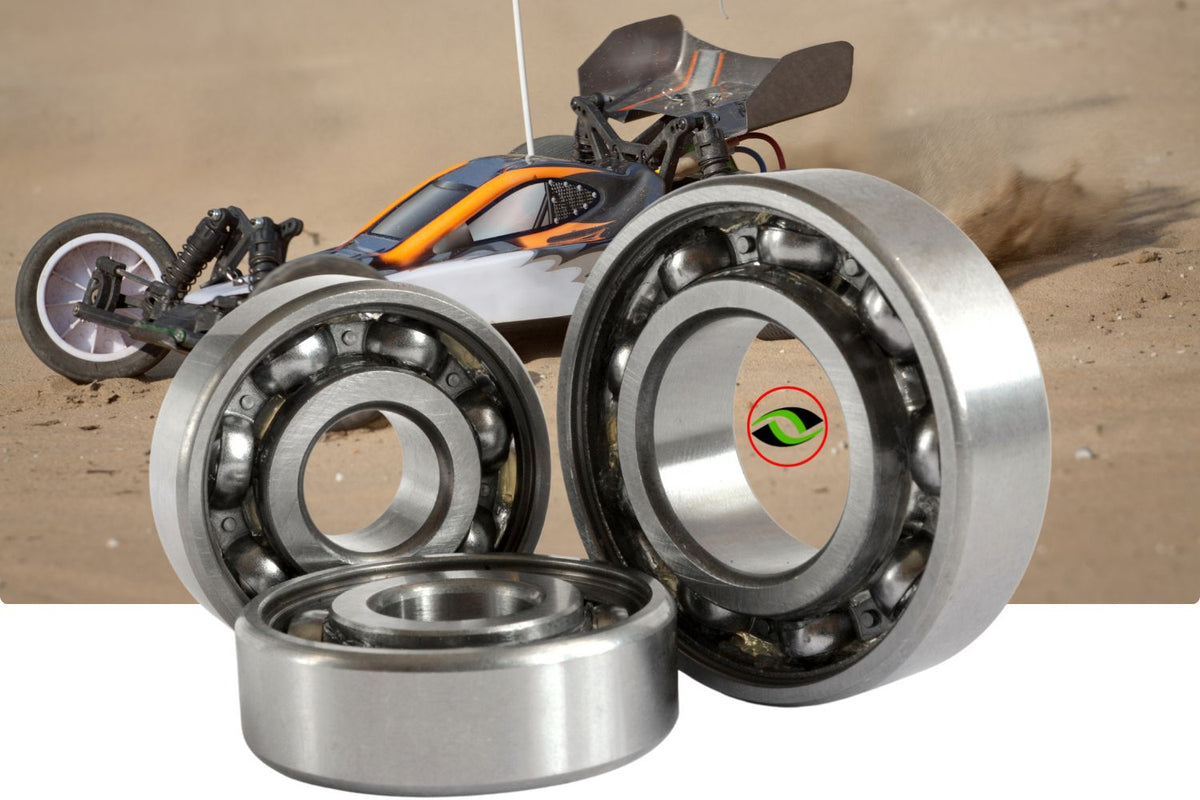 Clean RC bearings displayed in the foreground with an RC racing car on a dirt track in the background, highlighting maintenance and performance.